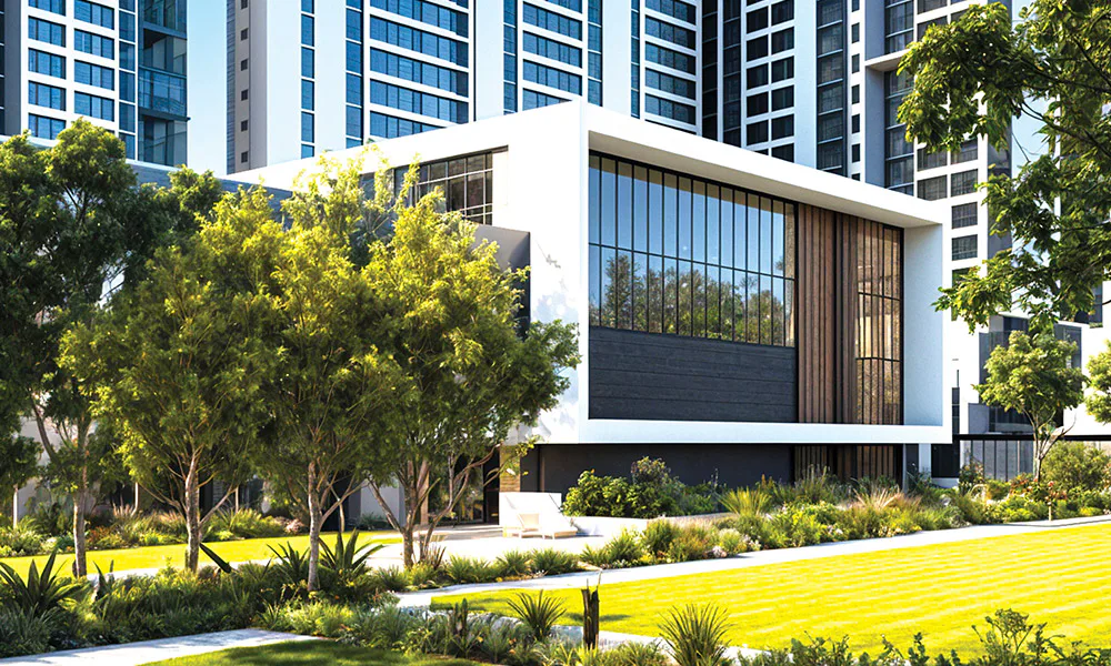 Clubhouse facade with trees and lawn at Rustomjee Urban Woods, Dombivli East