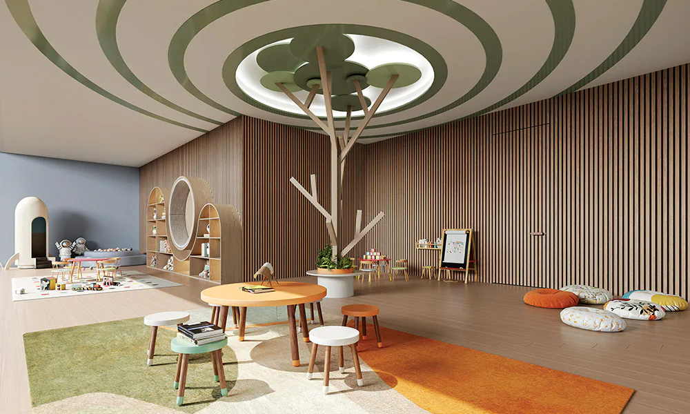Creche interior with a tree-shaped play structure at Rustomjee Urban Woods