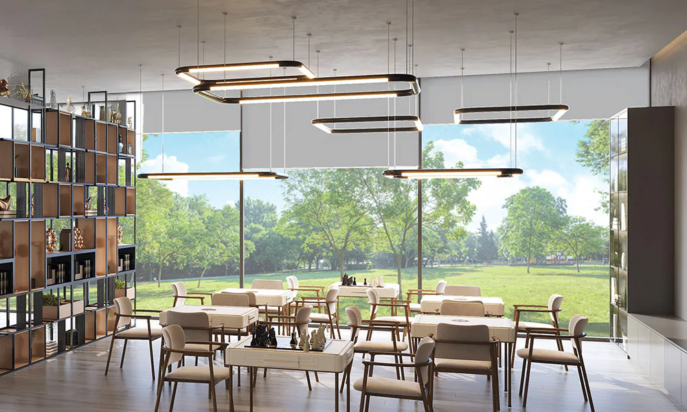 Indoor games room looking out over the central green at Rustomjee Urban Woods